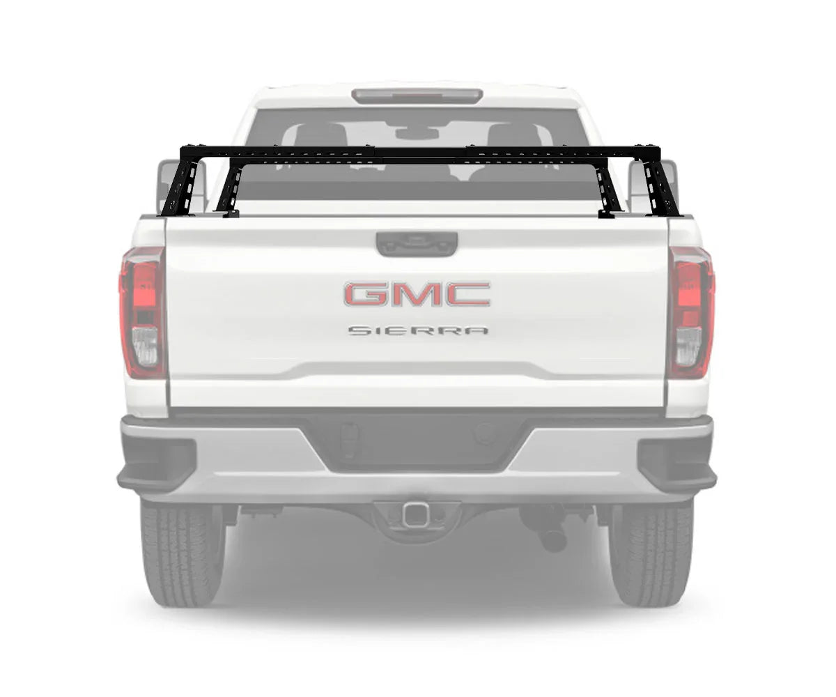 Overland bed bars installed on GMC Sierra 2500 truck bed, rear view.