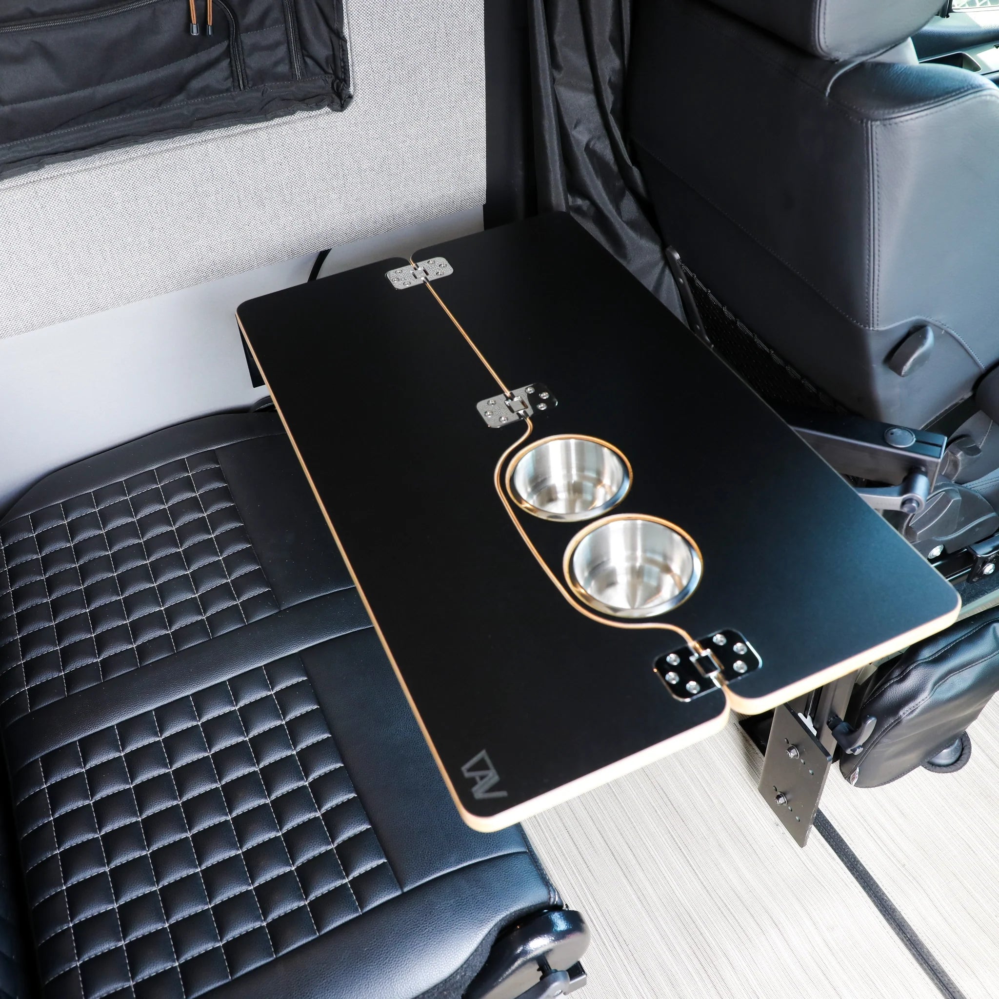 Foldable vehicle camping table with two built-in cup holders installed between seats