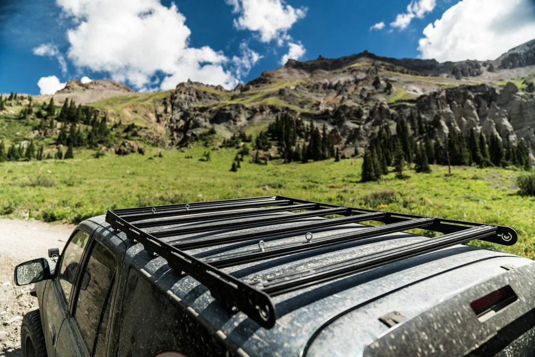 Toyota 4Runner with roof rack accessory parked outdoors on a mountain trail