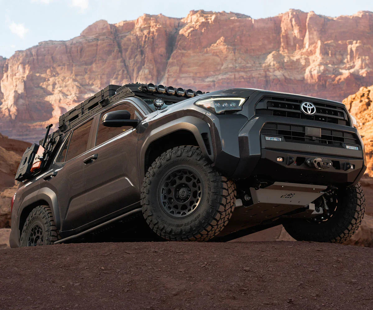 Toyota 4Runner outfitted with overlanding gear and off-road accessories on rocky terrain
