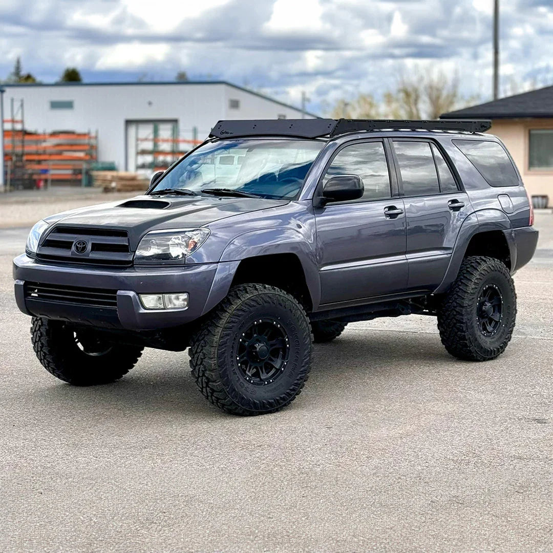 Toyota 4Runner with Prinsu Pro roof rack and off-road tires in parking lot