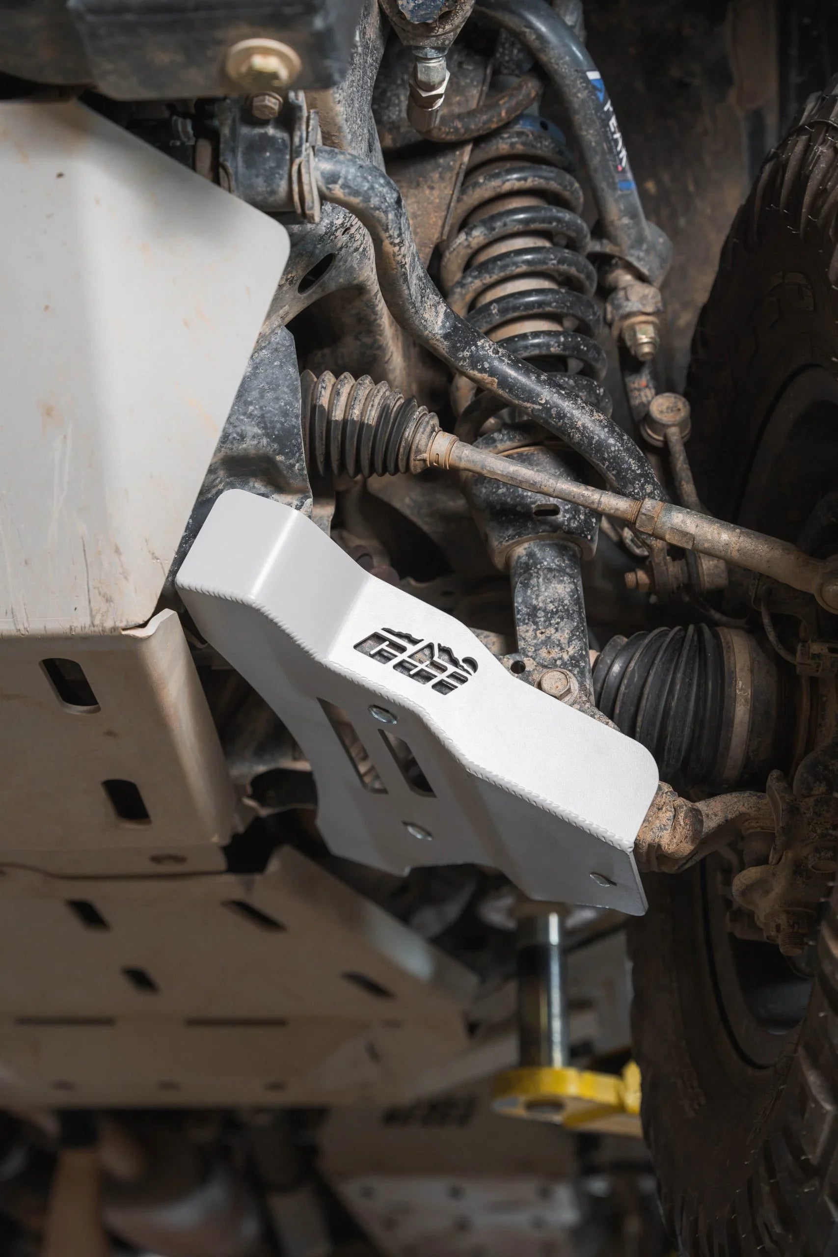 Toyota Tacoma off-road suspension with skid plate and control arm guard installed
