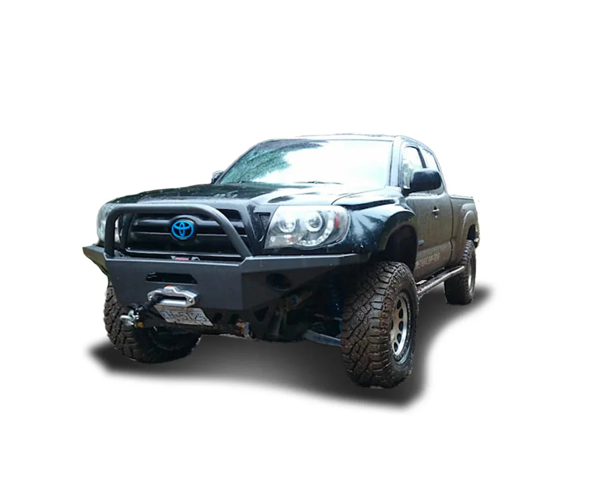 Lifted Toyota Tacoma truck with off-road bumper and mud-terrain tires for overlanding