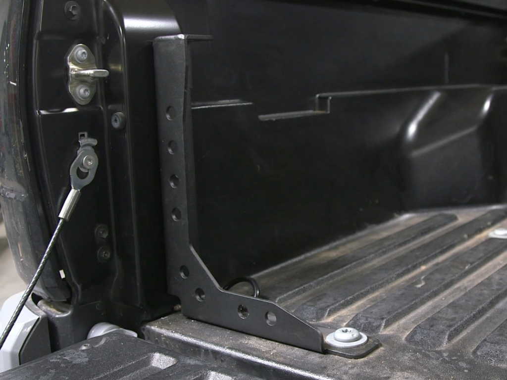 Toyota Tacoma bed channel support bracket installed in truck bed for overlanding gear