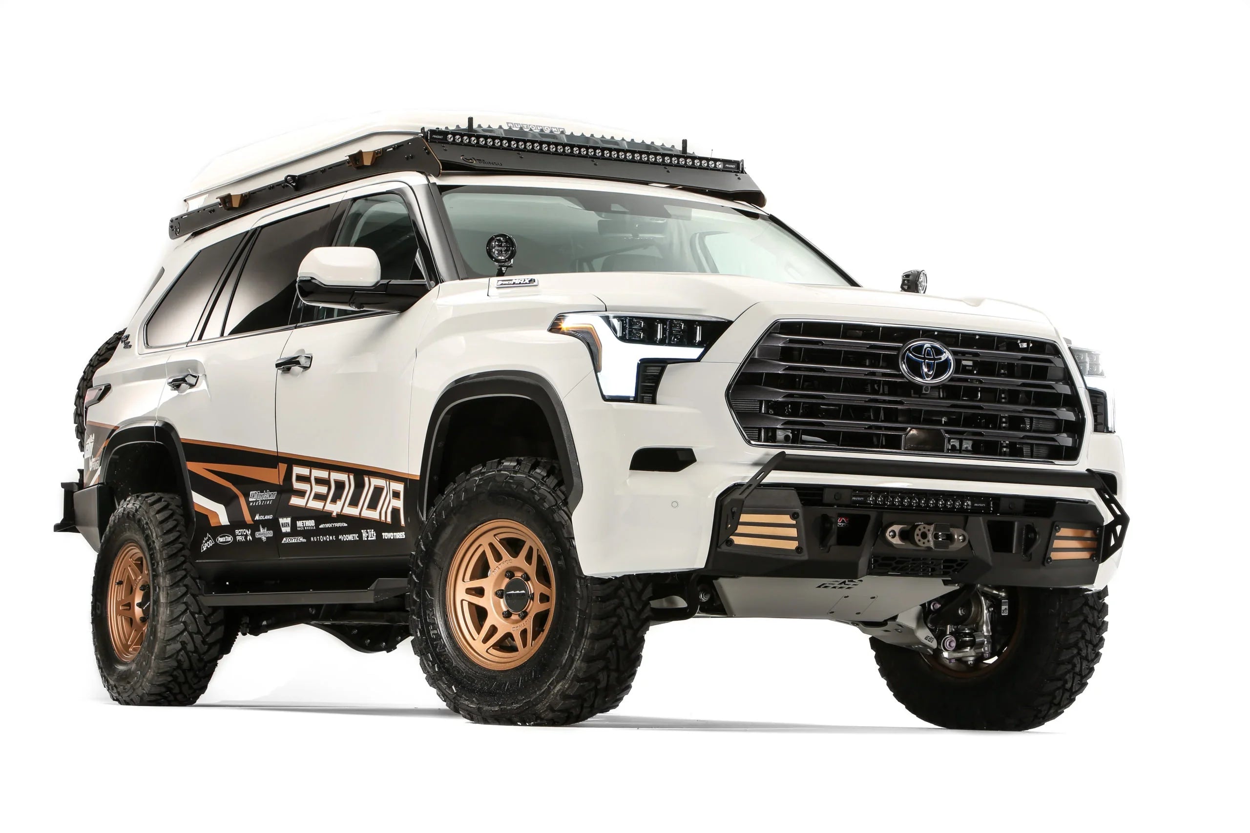 Toyota Sequoia TRD Off-Road overland vehicle with roof rack, off-road tires, and accessories
