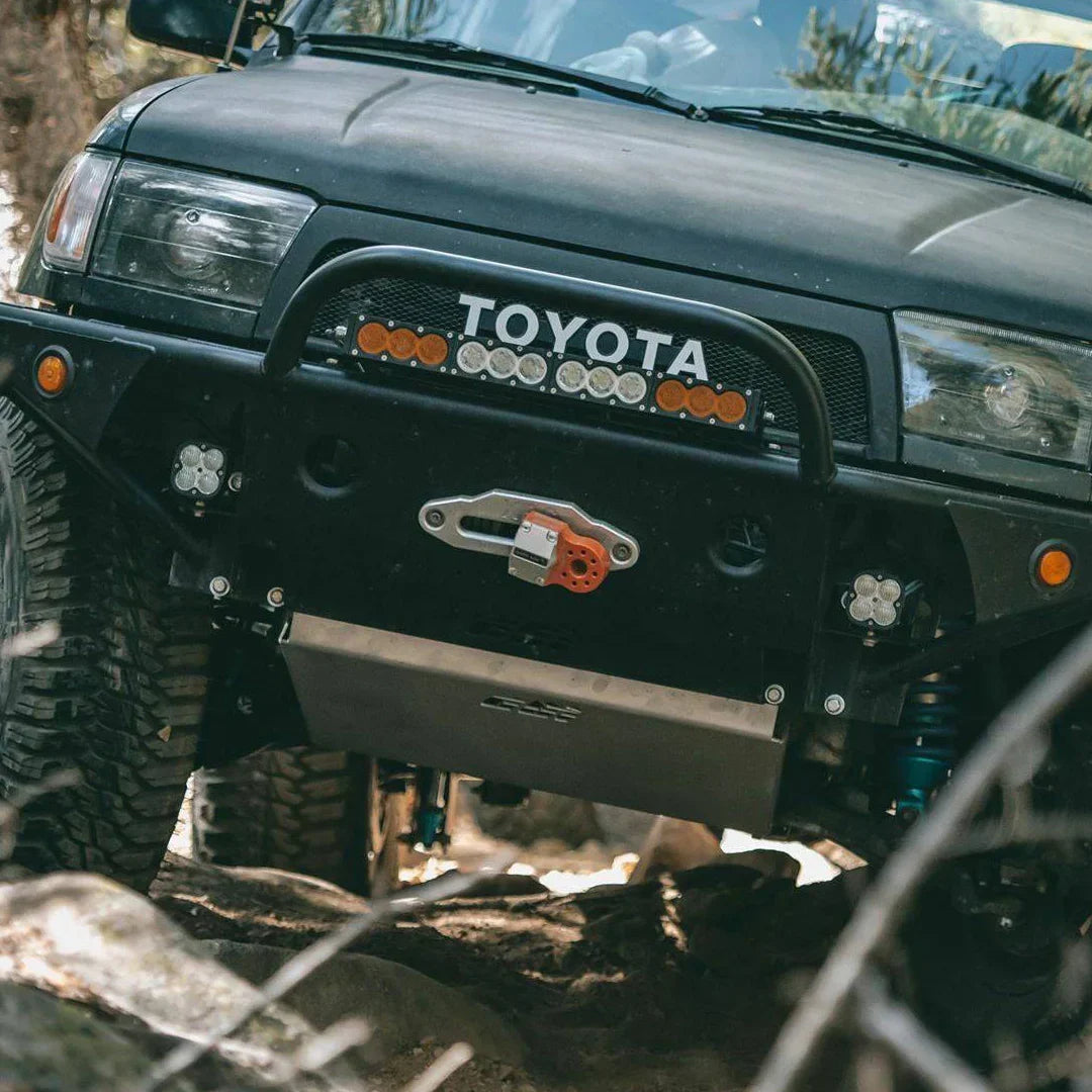 Toyota 4Runner with full skid plates and off-road bumper on rocky trail