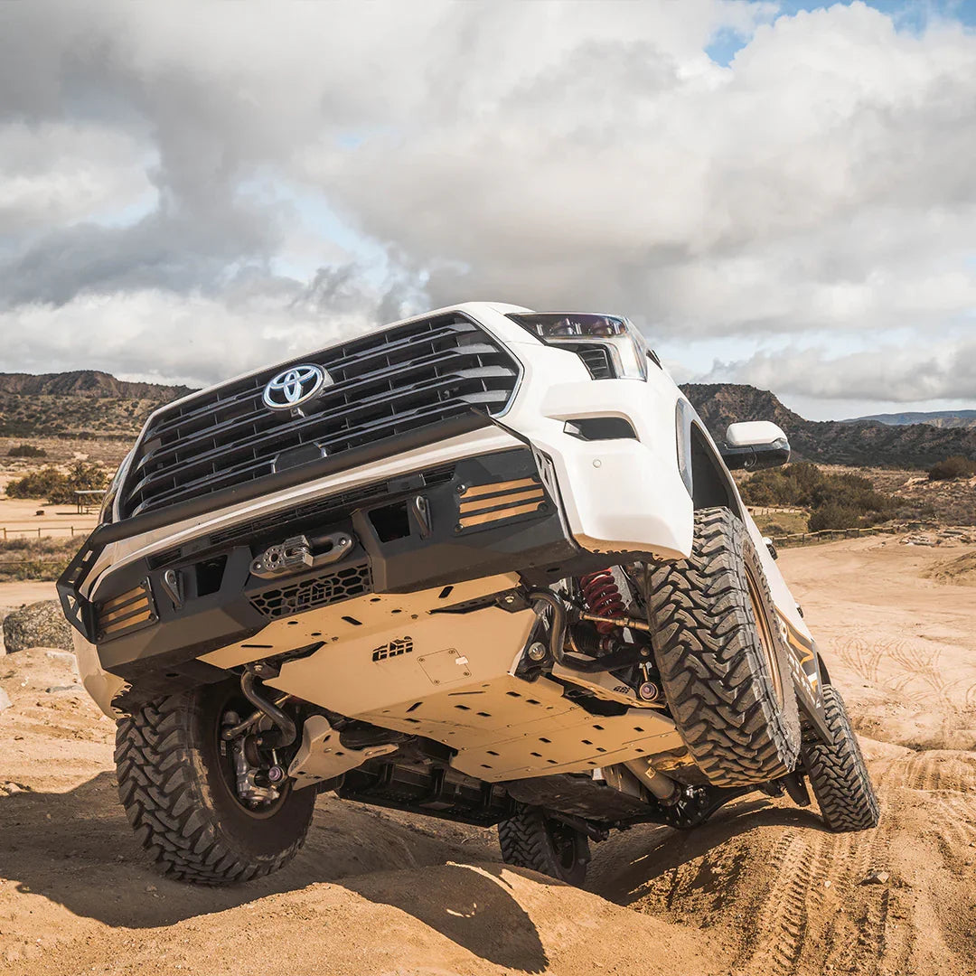 Toyota Sequoia off-road with skid plates on rugged trail, showcasing undercarriage protection