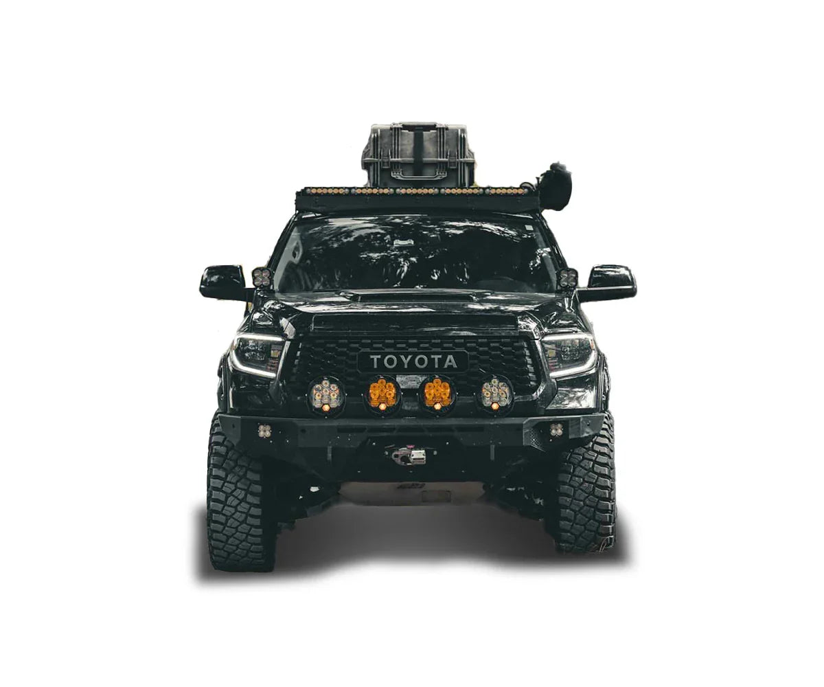 Toyota Tundra overland build with off-road bumper, roof rack, and auxiliary lights