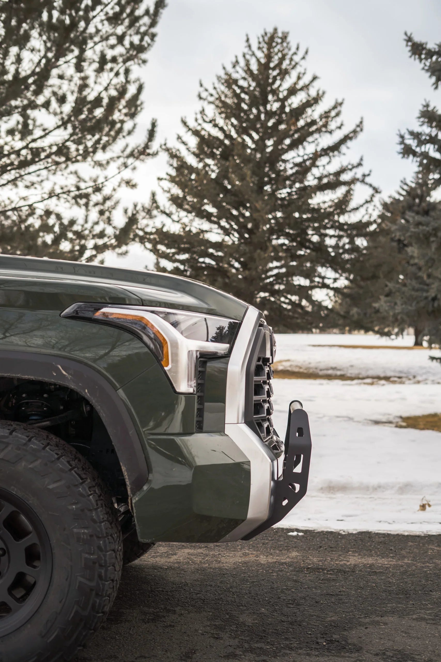 Toyota Tundra front bumper with off-road bar in winter outdoor setting