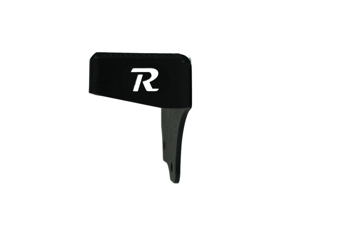 Black metal vehicle accessory part with R logo, isolated on white background