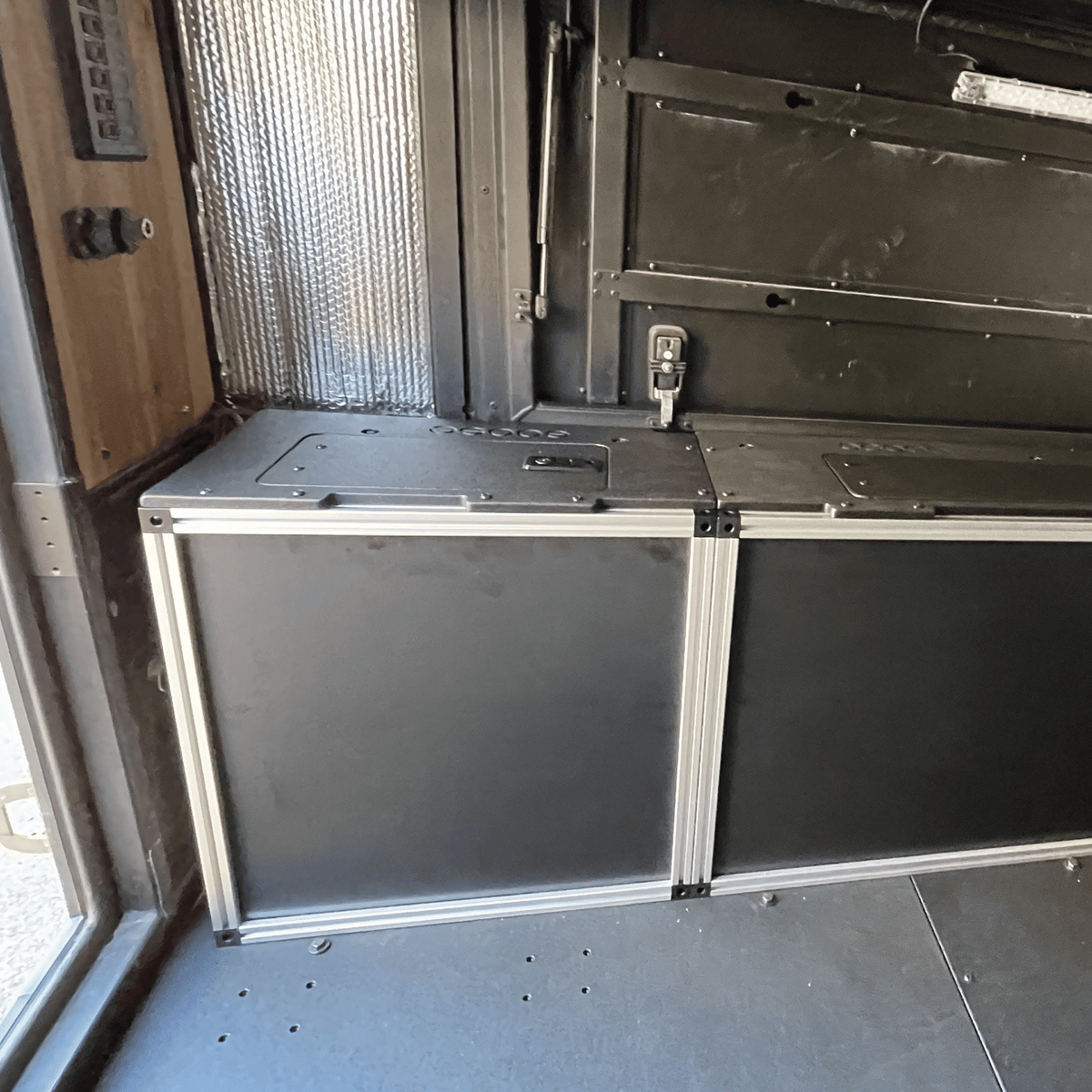 Goose Gear Alu-Cab Canopy Camper V2 rear utility module for a 6-foot Tacoma bed, two closed drawer-front panels