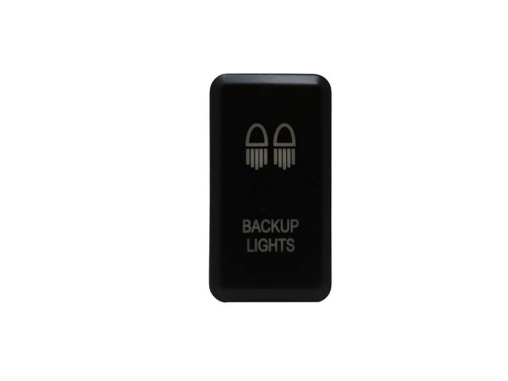 Black backup lights switch for off-road or overlanding vehicles, isolated on white background