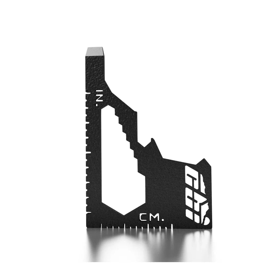 Black multi-tool measuring square with inch and centimeter markings on white background