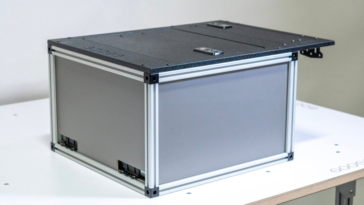 Goose Gear driver side front utility module for a midsize 5 ft truck bed with a gray side panel and slide-out top