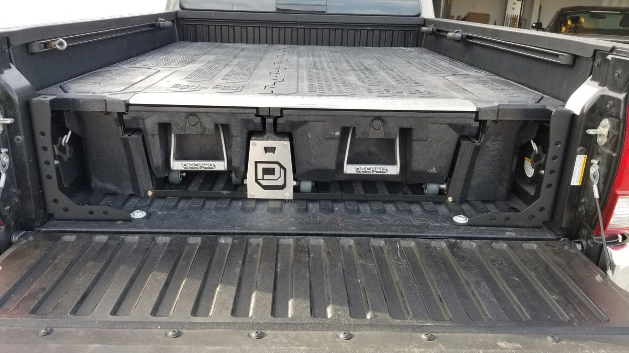 Truck bed with a DECKED drawer storage system for overlanding gear and vehicle organization.