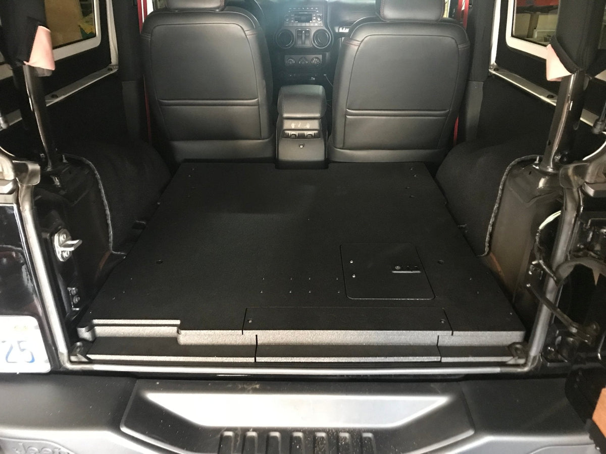 Goose Gear rear plate system in a 2007-2018 Jeep Wrangler JK 2 door, flat black cargo deck behind the front seats