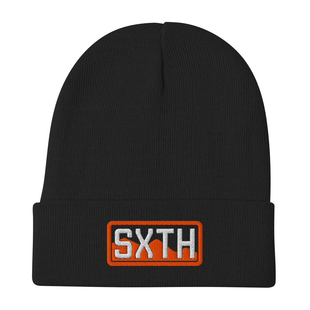 Black knit beanie with SXTH patch and orange border, front view