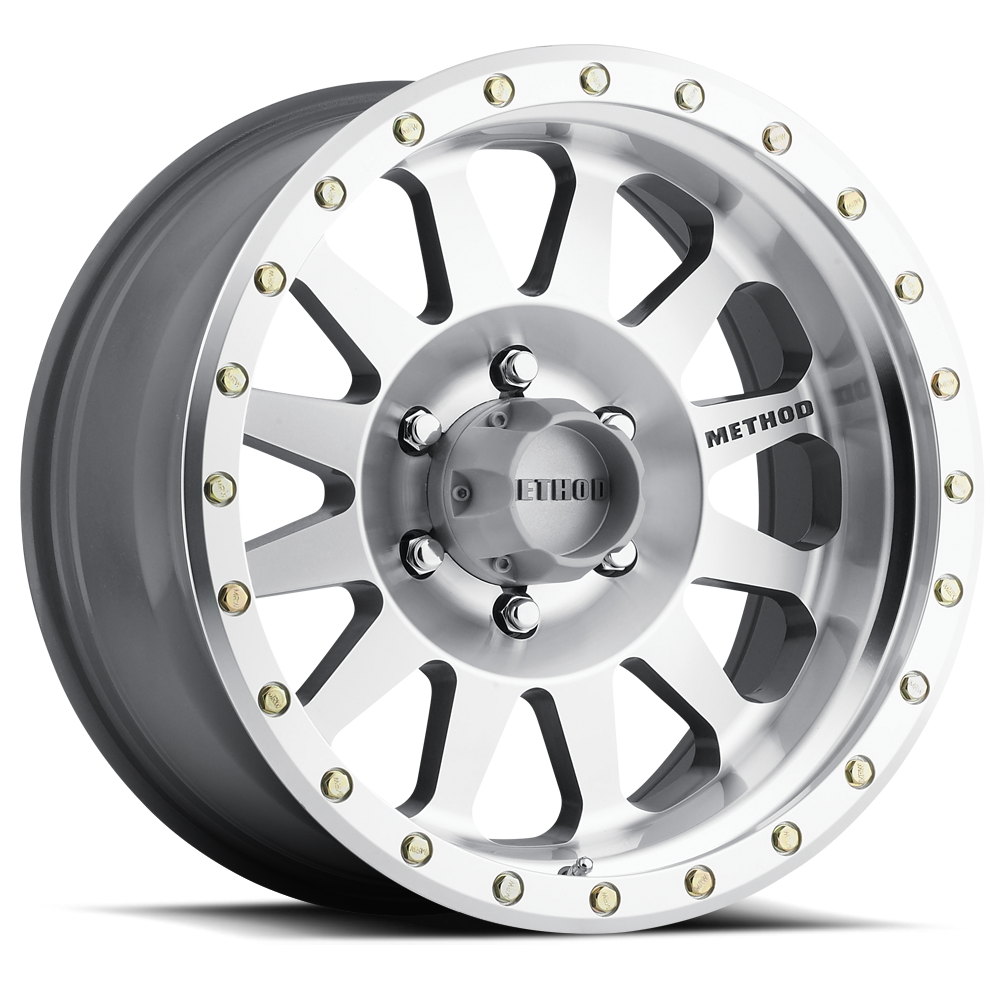 Silver alloy off-road wheel with beadlock design and multi-spoke pattern for trucks and SUVs