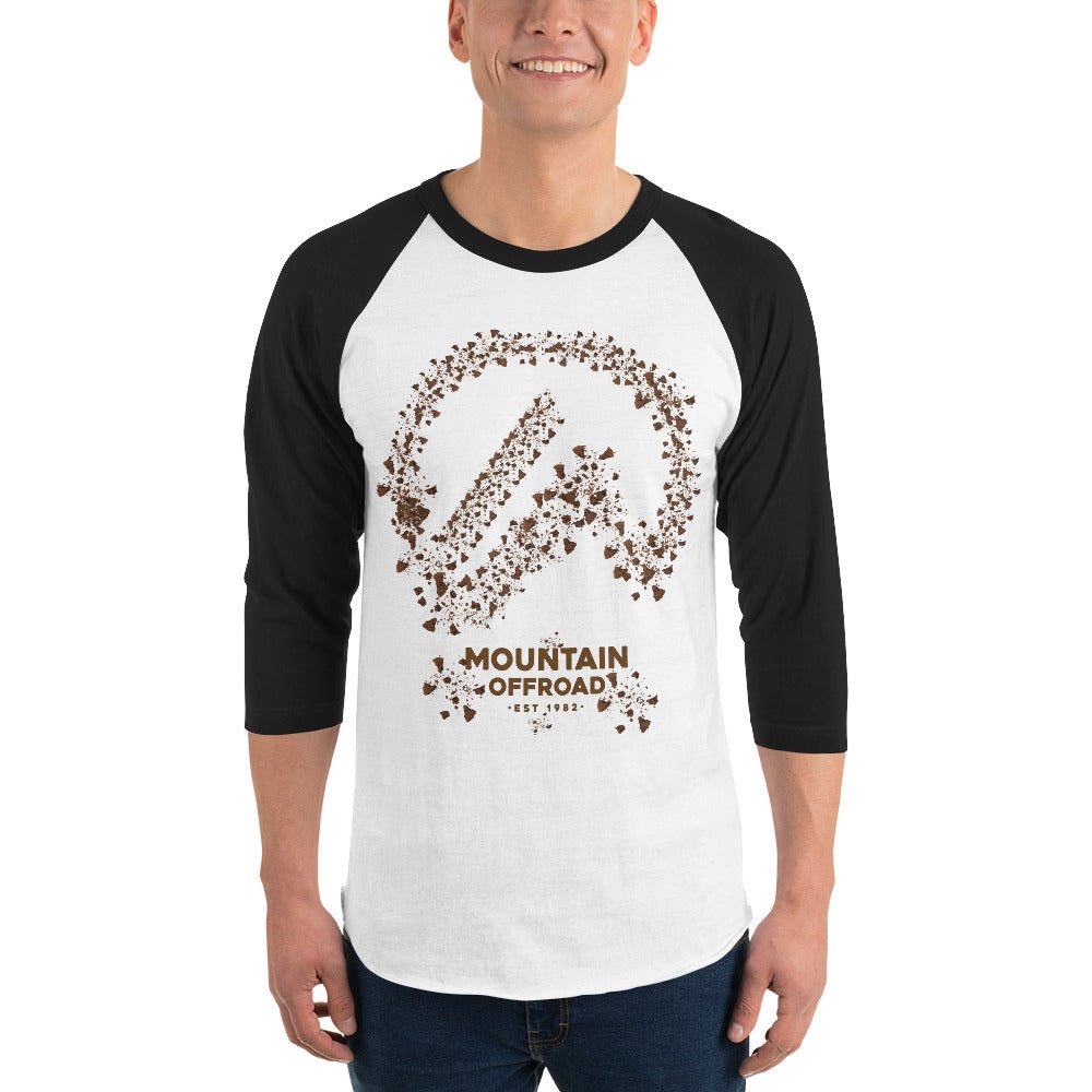 Man wearing black and white raglan tee with Mountain Offroad graphic for adventure gear
