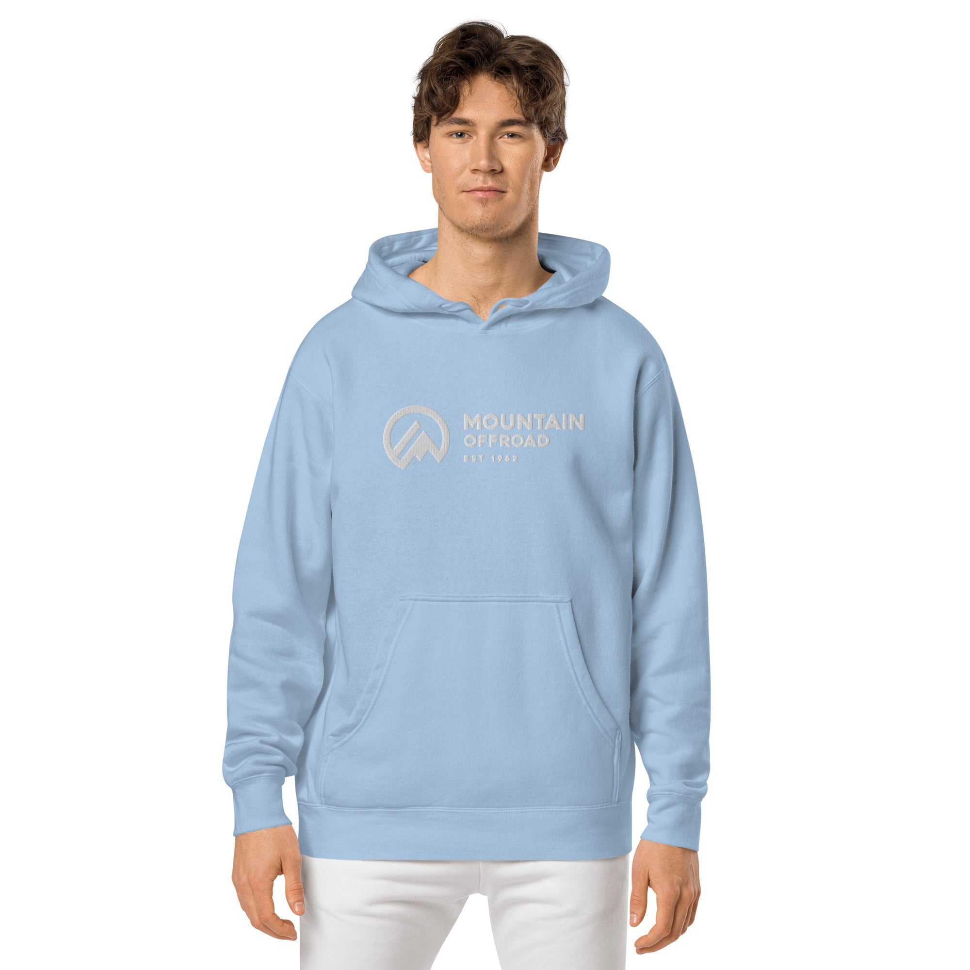 Man wearing light blue hoodie with 'Mountain Offroad' graphic, front view