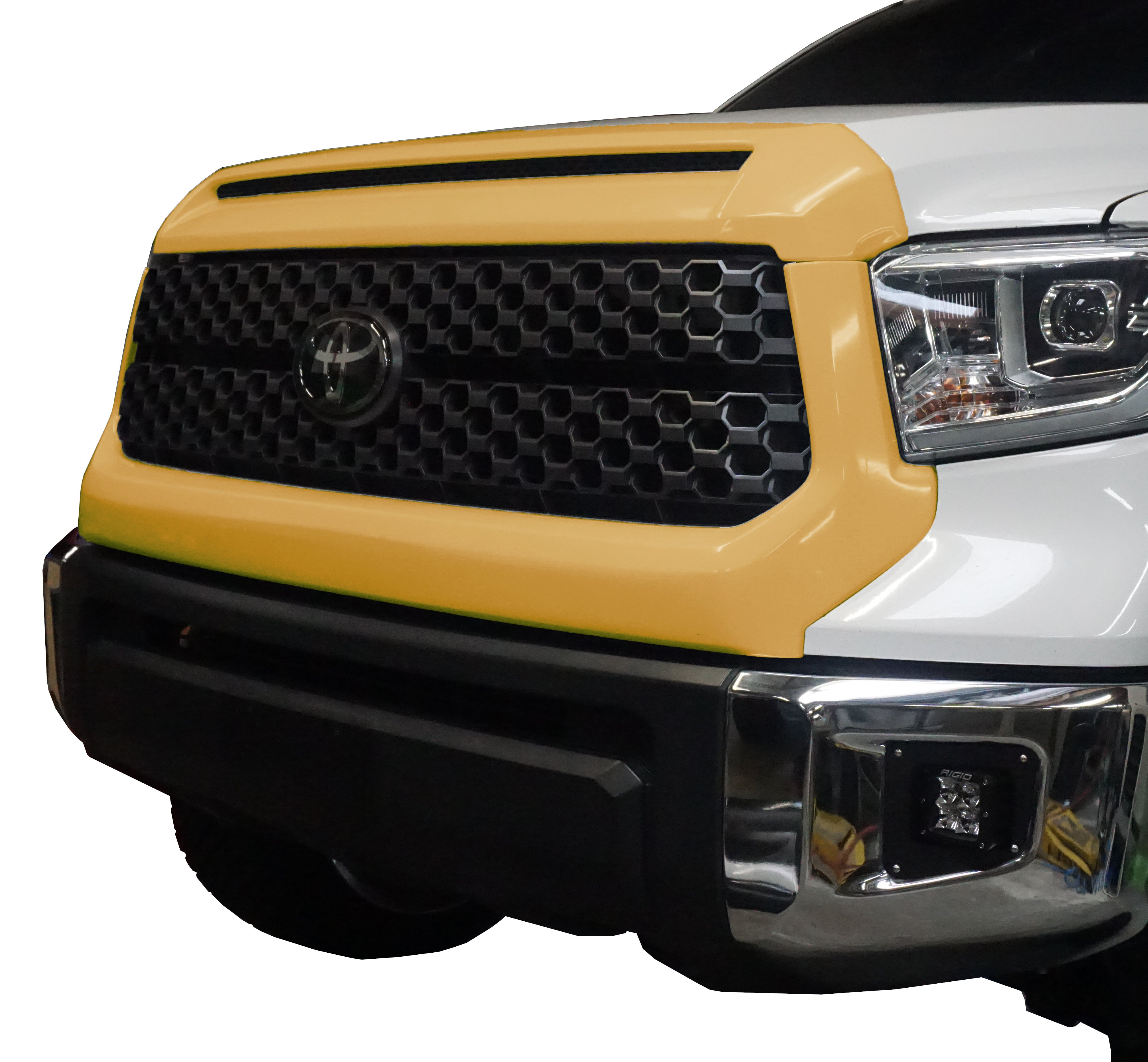 A close-up of the Quicksand (Color Code: 4V6) BumperShellz overlay, designed specifically for the grille surround and hood bulge on a 2014-2021 Toyota Tundra.