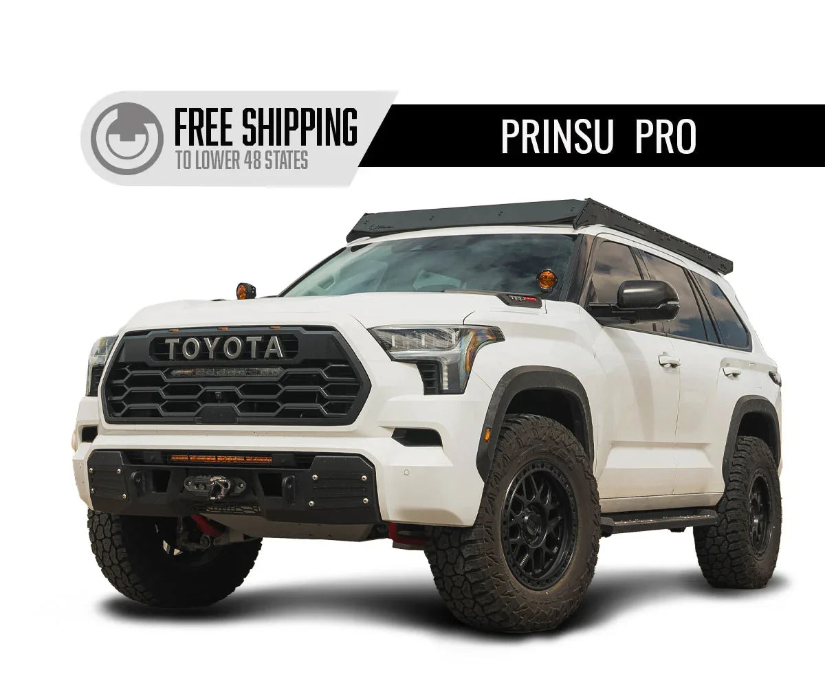 White Toyota Sequoia with roof rack, off-road tires, and adventure vehicle accessories