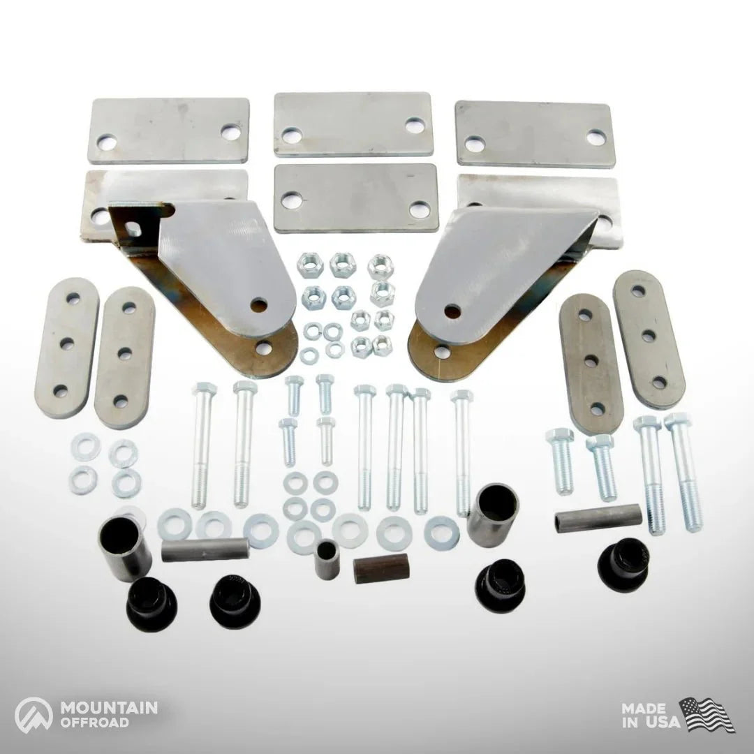Shackle reversal system kit for Jeep CJ 1976-86 with YJ springs, metal plates, brackets, bolts.