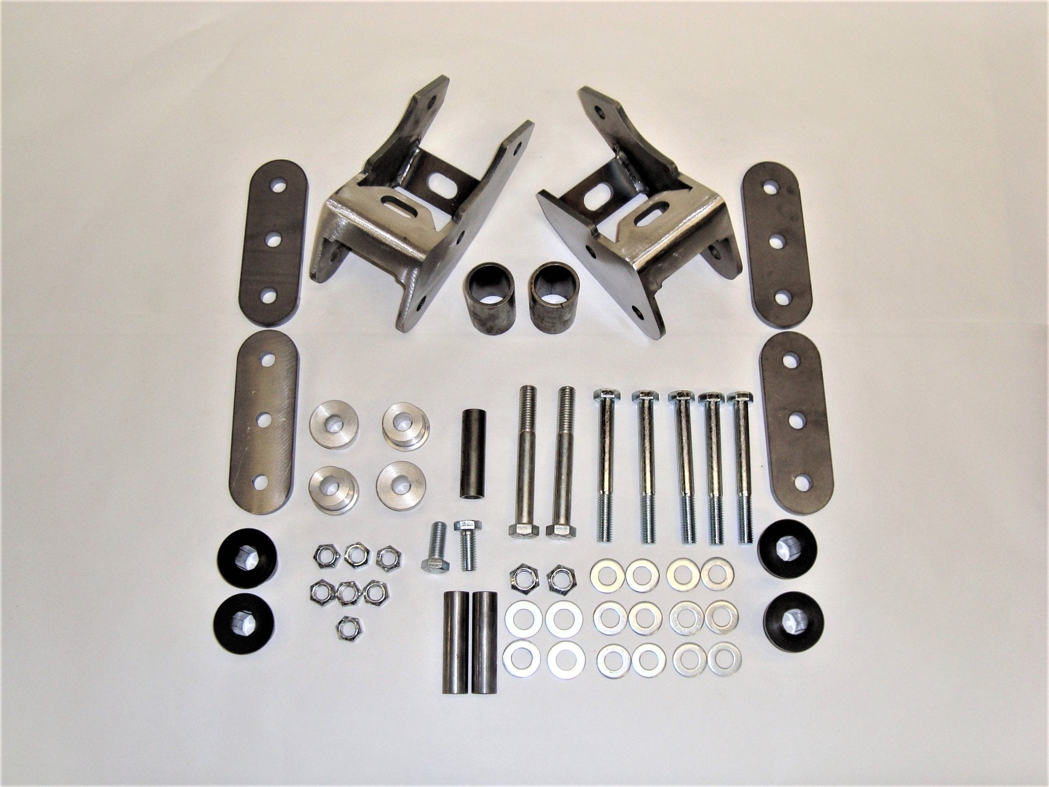 Shackle reversal system with weld-in shackle hanger and hardware for Jeep Wrangler YJ 1987-95