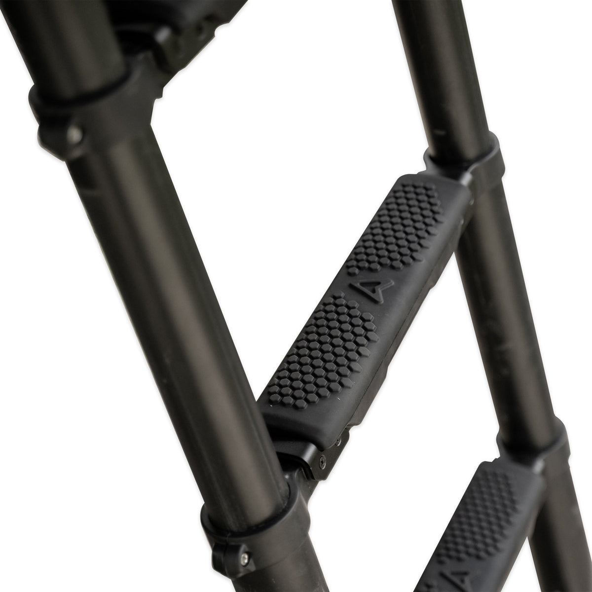 Close view of ROAM ladder soft steps, black ribbed rubber treads on a rooftop tent ladder