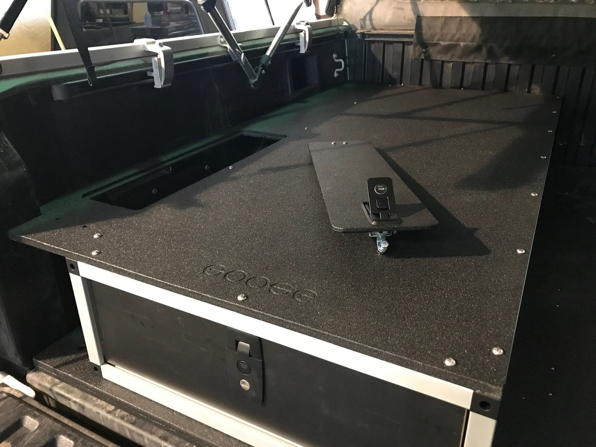 Goose Gear single drawer module with textured top plate in the bed of a Toyota Tacoma, drawer front visible