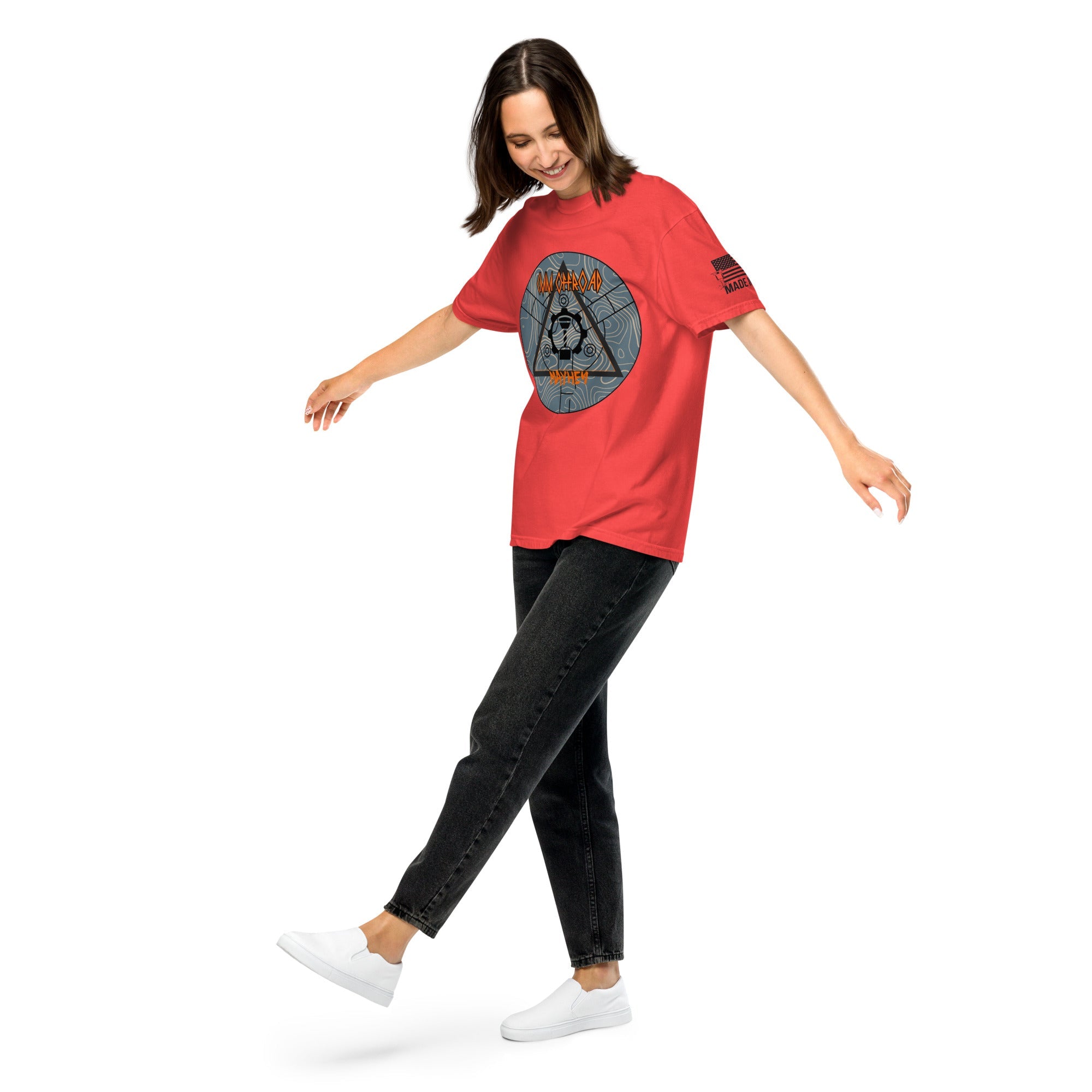 Woman wearing paprika red heavyweight unisex t-shirt with graphic print, black jeans, white sneakers