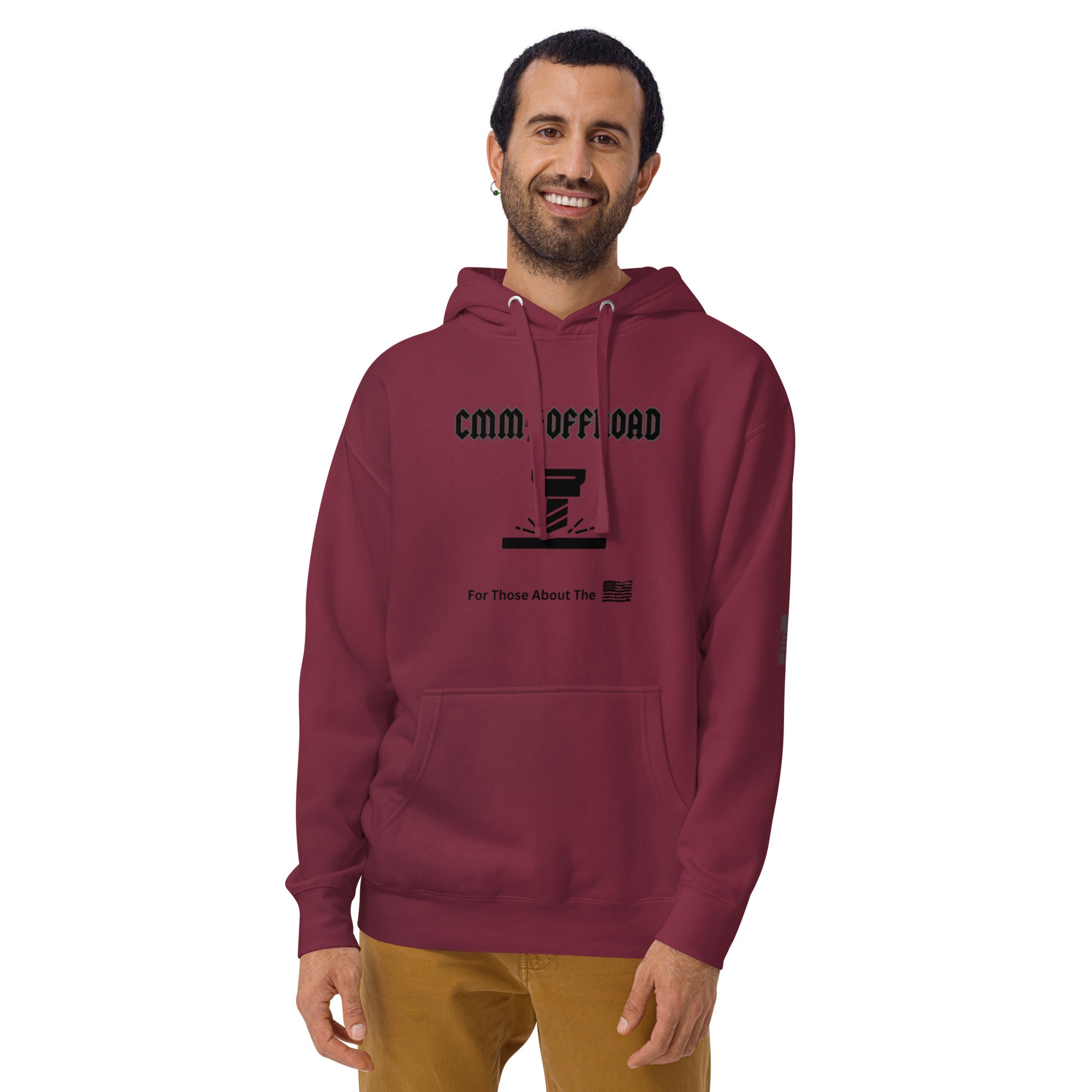 Man wearing maroon unisex hoodie with CMM OFFROAD logo, front pouch, adventure style