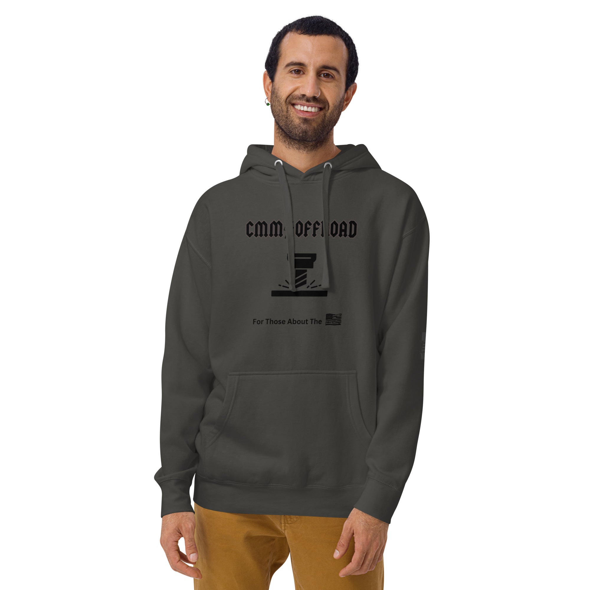 Unisex vintage black hoodie with off-road graphic and front pocket, worn by a smiling man