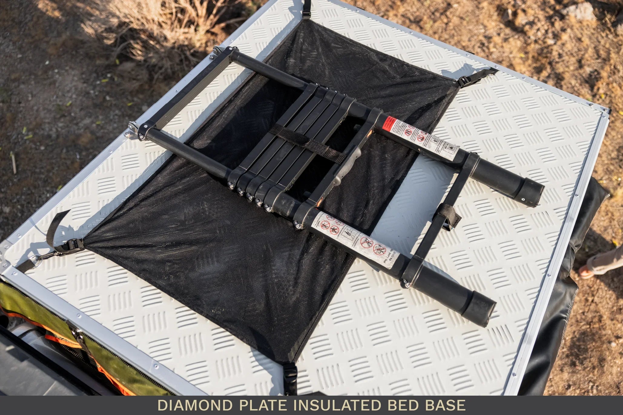 Collapsible ladder on diamond plate insulated bed base for overlanding or camping vehicles
