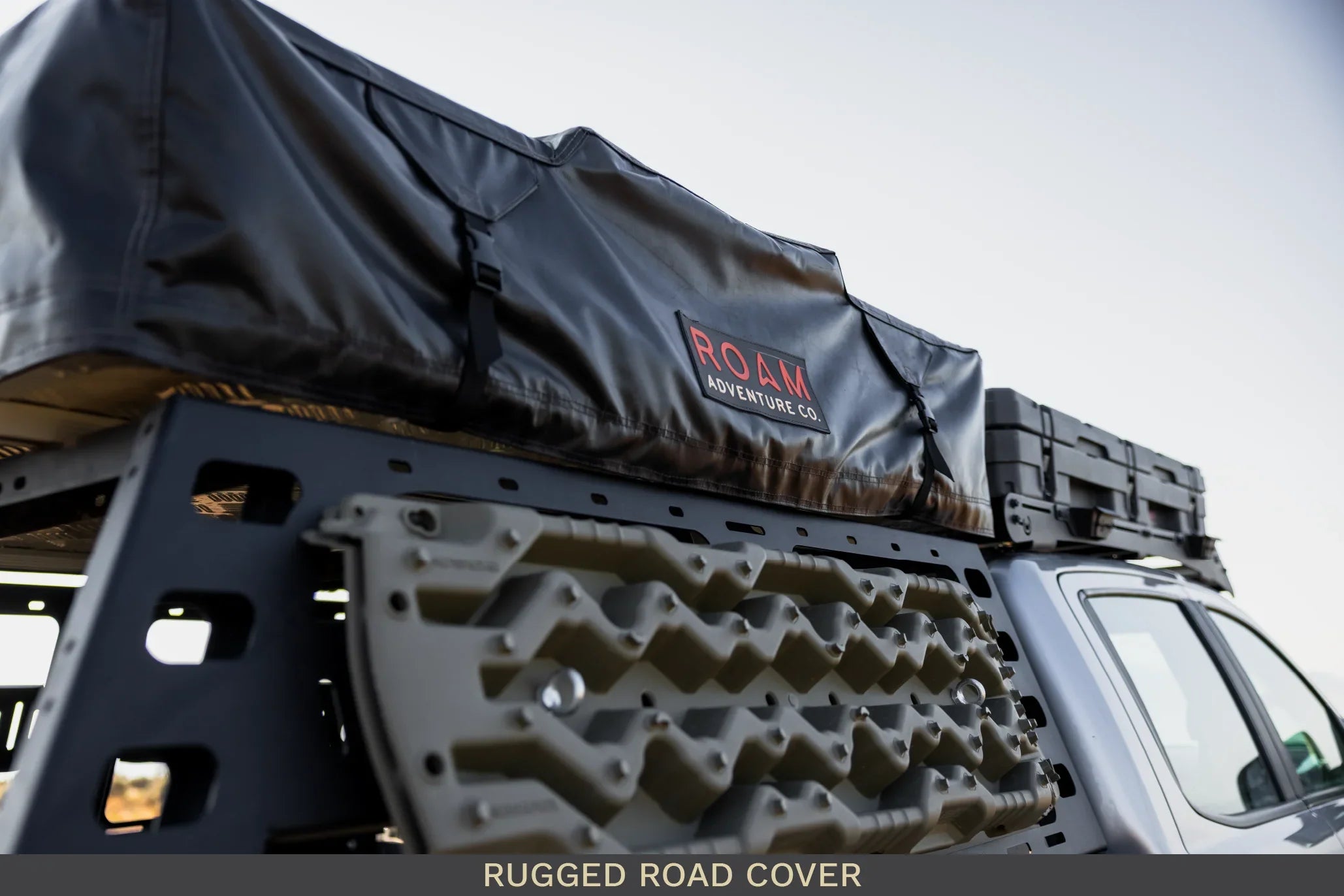 Truck roof rack with ROAM Adventure gear, recovery boards, overlanding accessory storage